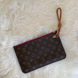 Authentic Louis Vuitton Neverfull Clutch- rarely used has been in storage.